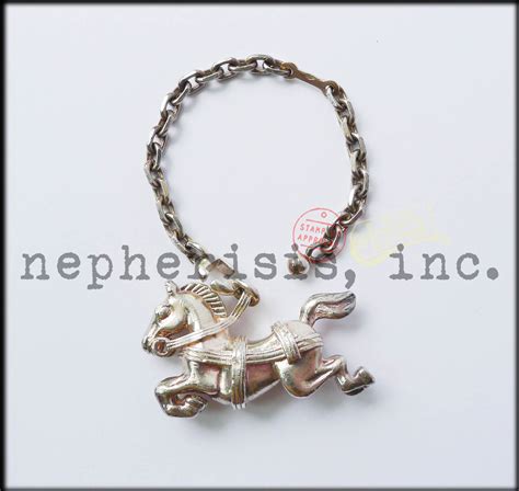 hermes rocking horse charm